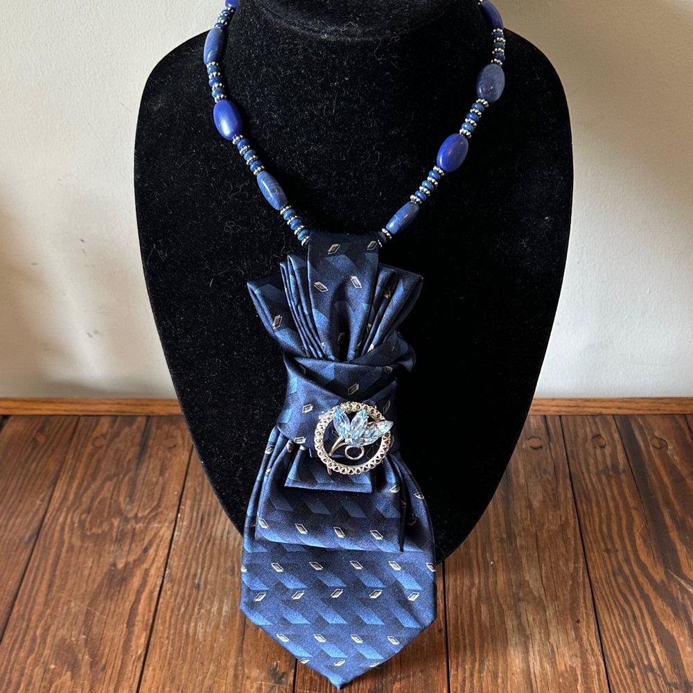 Elegant Vintage Silk Blue Necktie with Beaded Necklace and Vintage Brooch